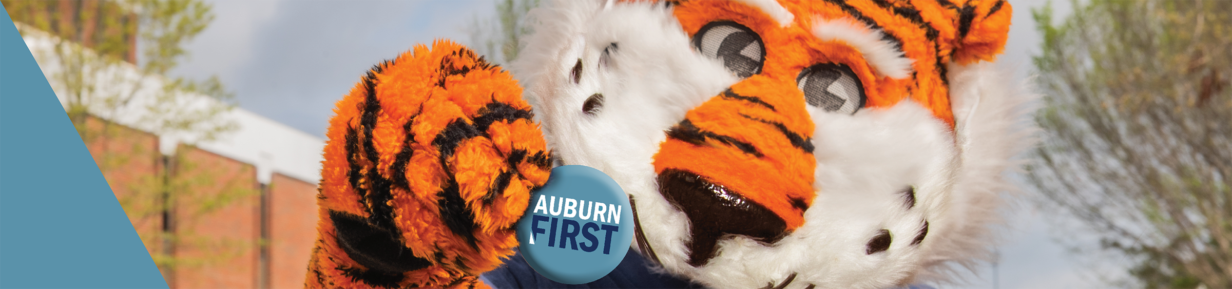 Auburn First aubie holding pin